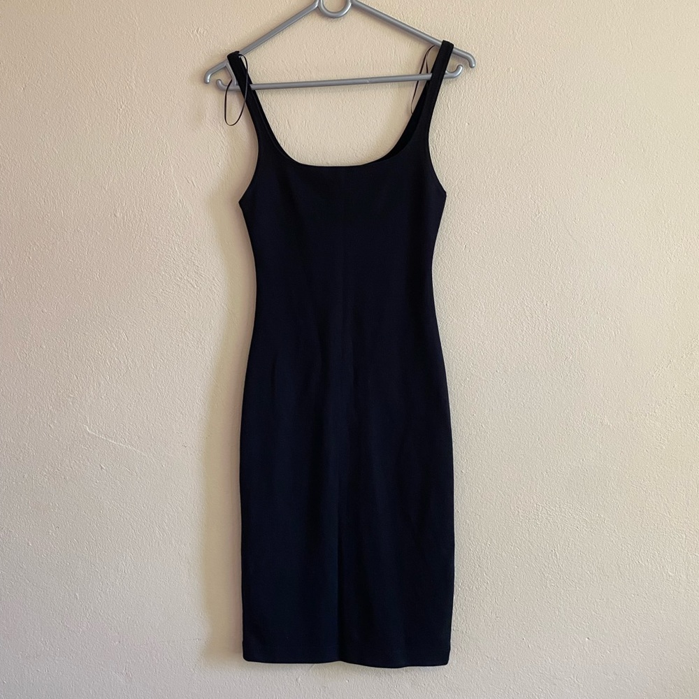 Zara black bodycon dress with slit at the back. A really versatile piece.